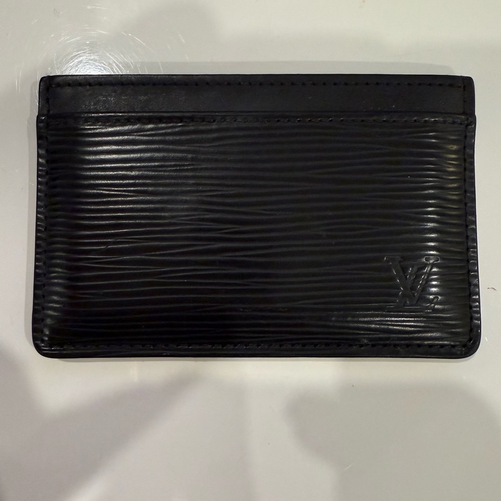 Louis Vuitton Epi Leather Card Holder in black.